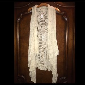 Cream sweater vest, one size, new without the tag.